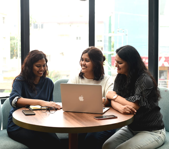 Three team members enjoying a discussion